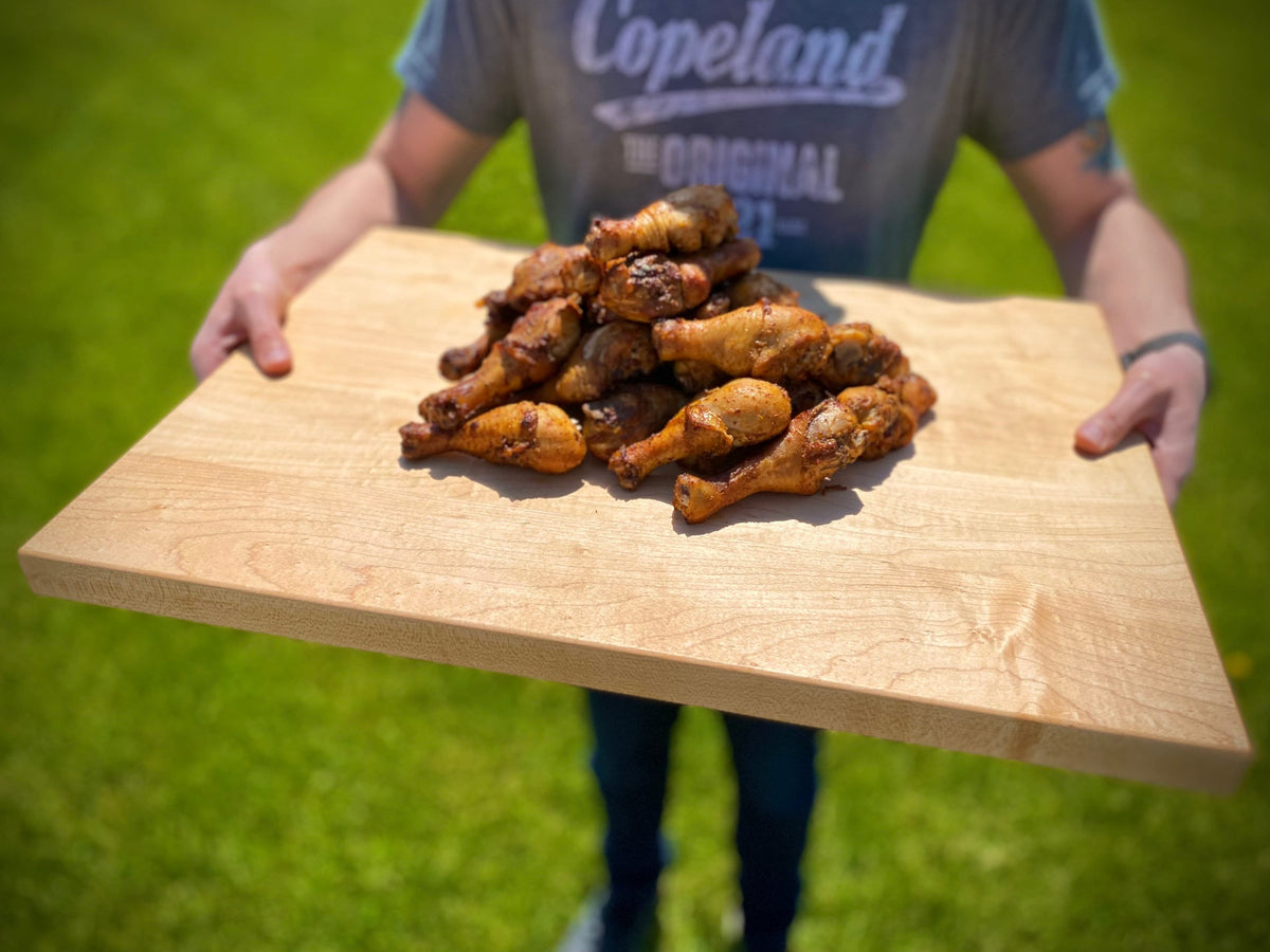 Refine Kitchenware maple butcher block cutting board 1.25in thick with rubber feet outdoors on Tampa Home & Garden Store