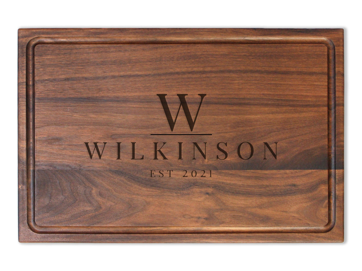 Personalized walnut cutting board with Wilkinson engraving and EST 2021 on wood on Tampa Home & Garden Store
