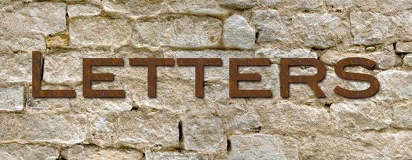 Blair Font rustic metal house numbers letters set of 6 in brown rust finish on stone wall on Tampa Home & Garden Store
