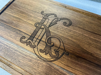 Custom logo cutting board with ornate monogram engraving on wood on Tampa Home & Garden Store