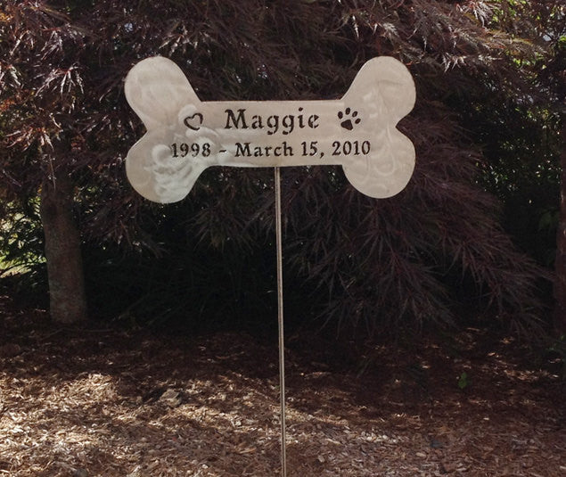 Stone-colored dog bone memorial sign on a metal stake, Rustica Ornamentals, Maggie 1998–2010 on Tampa Home & Garden Store