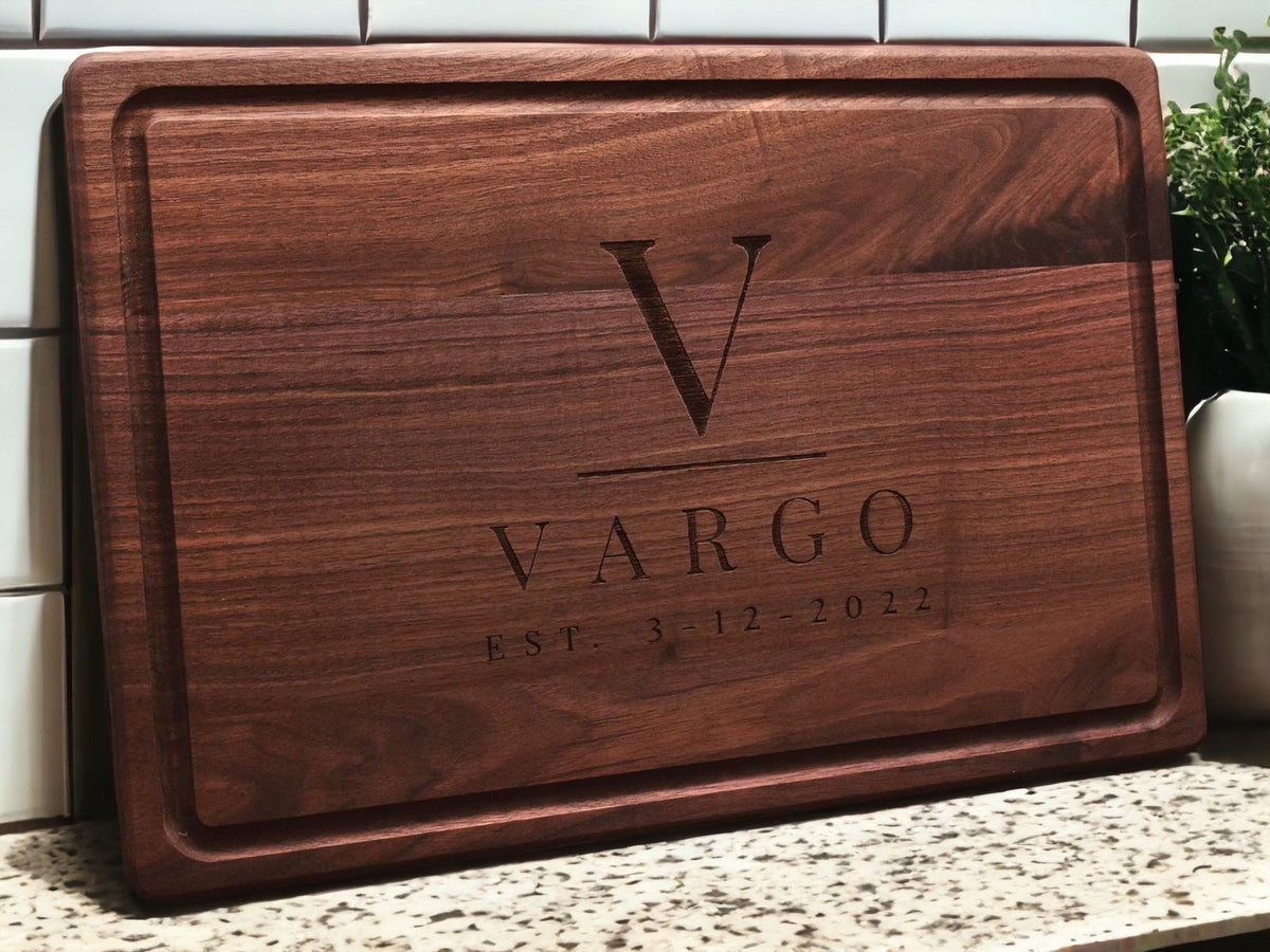 Custom engraved walnut cutting board with VARGO engraving and EST 3-12-2022 on Tampa Home & Garden Store