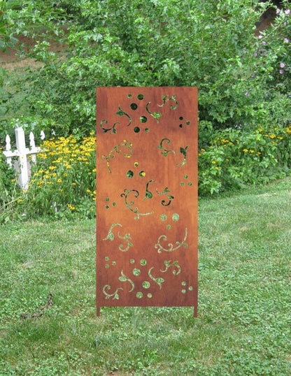 Outdoor privacy screen tall rust-colored metal panel with decorative vine cutouts on Tampa Home & Garden Store