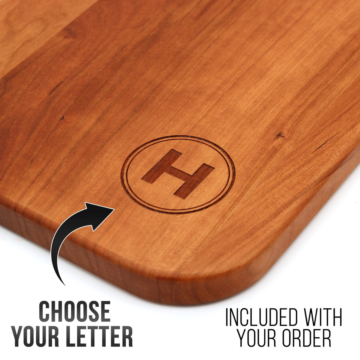 Cherry wood charcuterie board with circular H monogram, personalized last name letter on Tampa Home & Garden Store