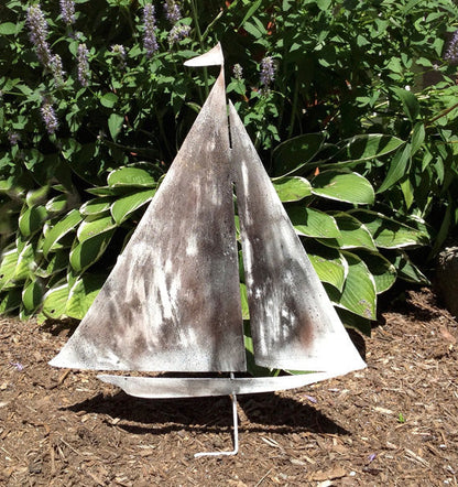 Sailboat garden stake sculpture in weathered metal with two sails lawn ornament on Tampa Home & Garden Store