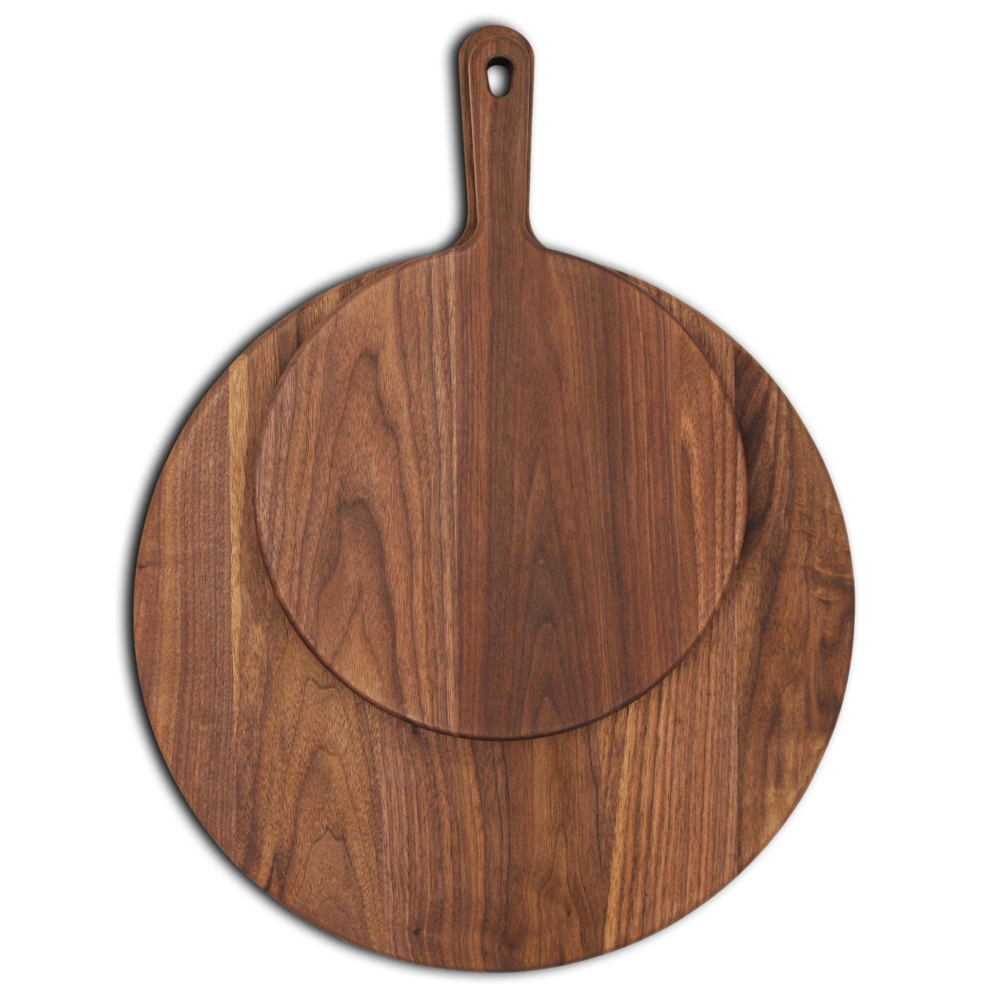 XL Walnut paddle cutting board with handle; round charcuterie boards stacked on Tampa Home & Garden Store