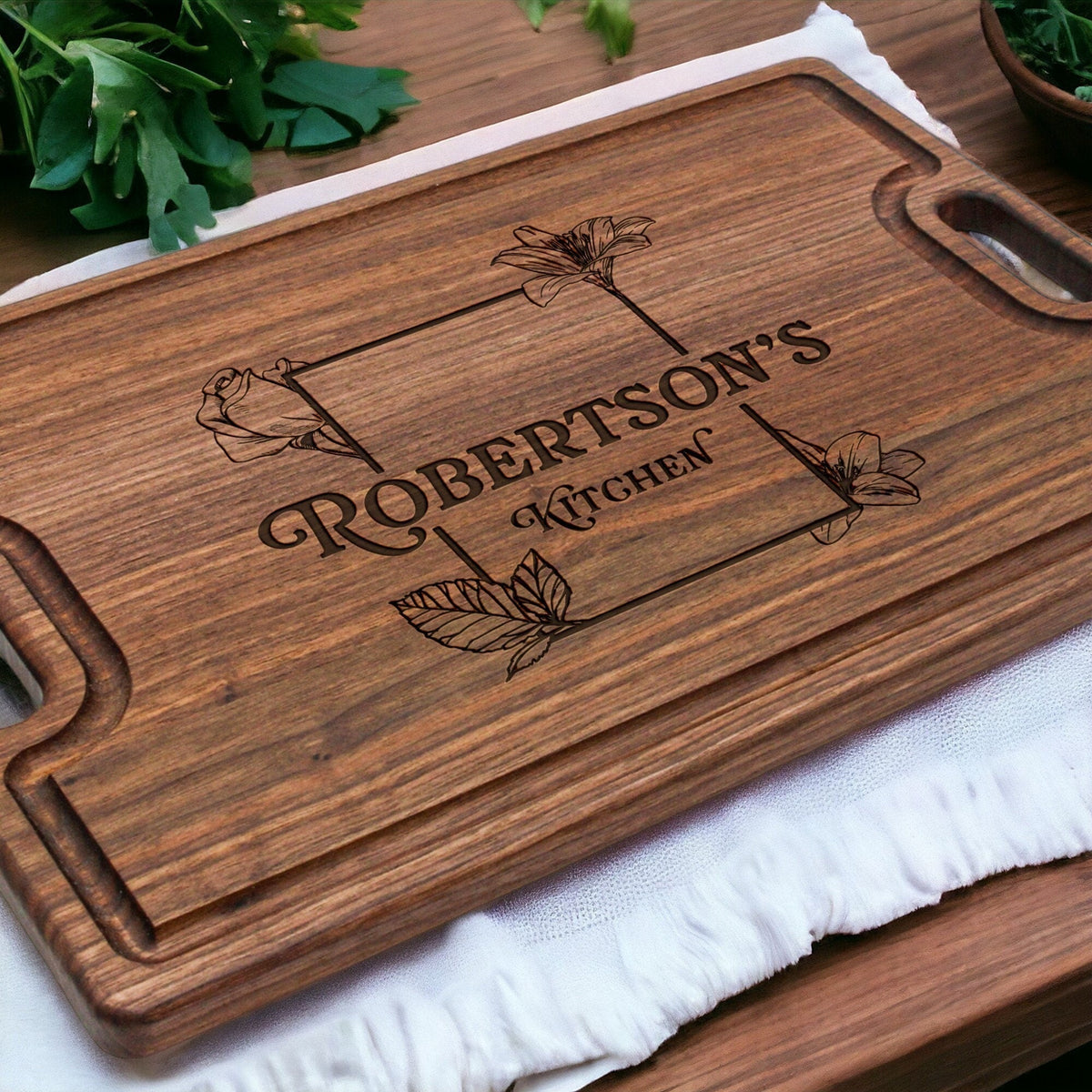 Personalized cutting board with last name engraving and floral motif by Refine Kitchenware on Tampa Home & Garden Store
