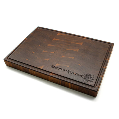 Walnut end-grain cutting board with maple block pattern and Betty's Kitchen engraving on Tampa Home & Garden Store