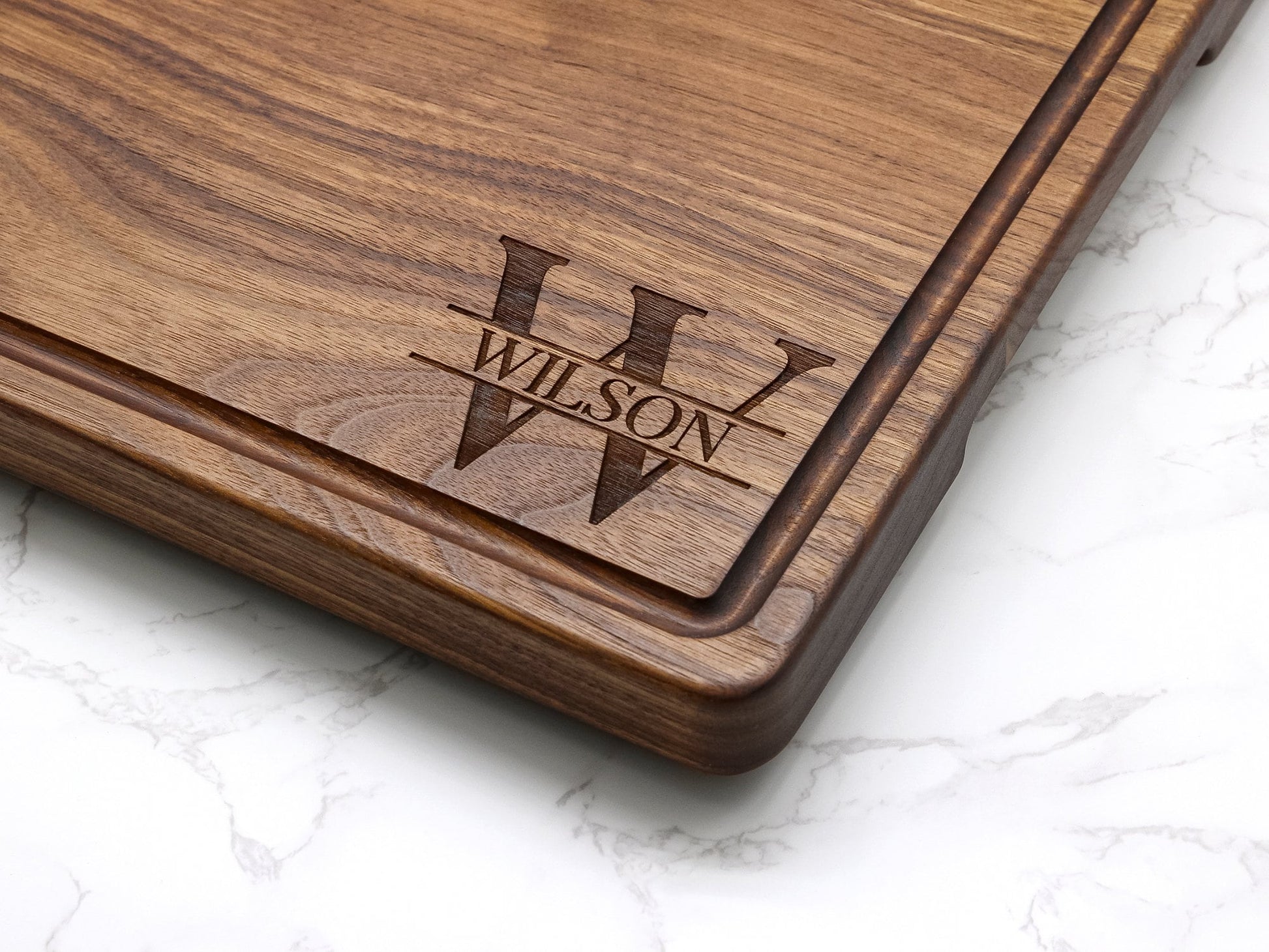 Personalized 1.25in thick extra-large wood cutting board with feet juice groove, engraved WILSON on Tampa Home & Garden Store