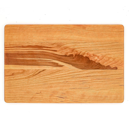 Cherry wood cutting board with rounded corners and rich grain 18 x 12 in on Tampa Home & Garden Store