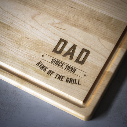 King of the Grill cutting board engraved with DAD since 1998 on natural wood on Tampa Home & Garden Store