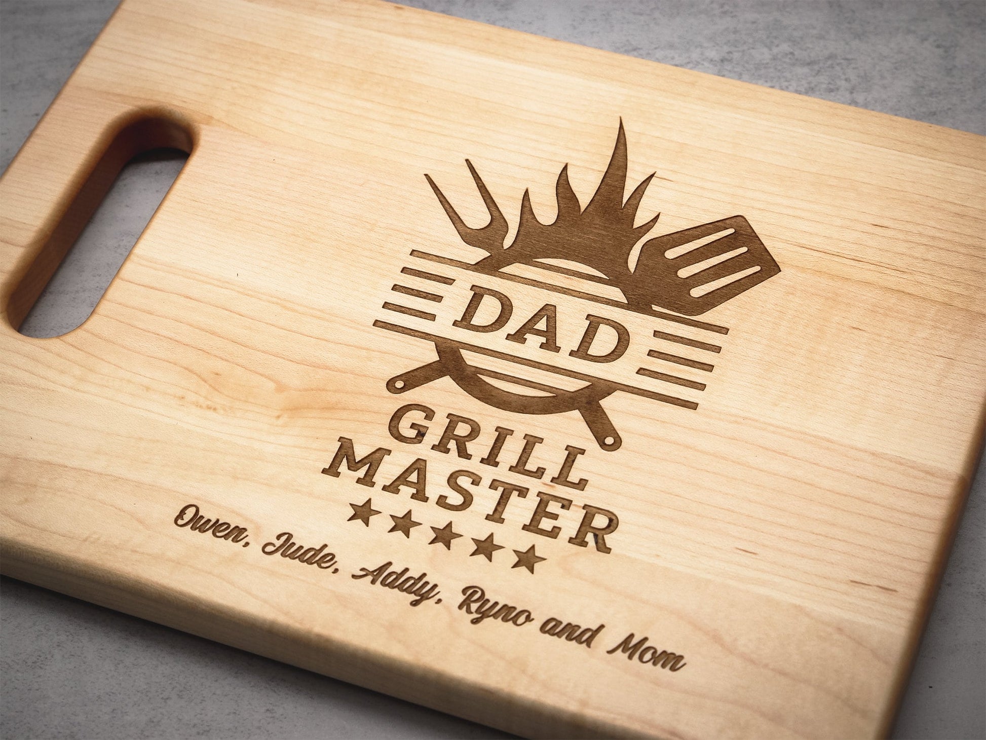 Personalized Dad Grill Master cutting board with engraved flame logo by Refine Kitchenware on Tampa Home & Garden Store