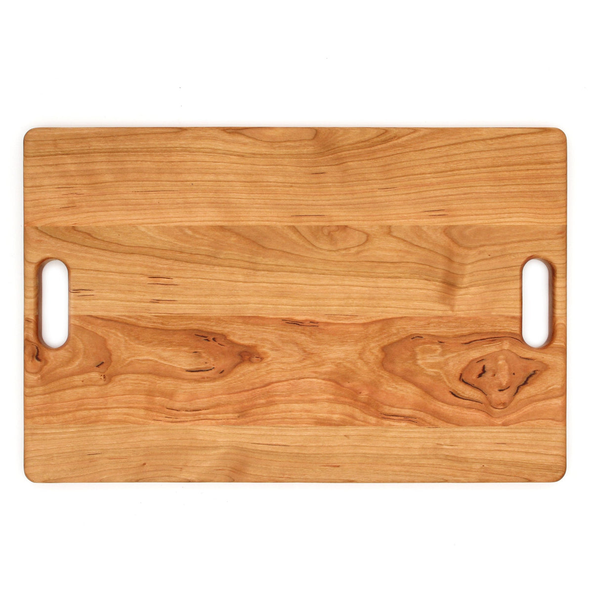 Cherry wood cutting board with rounded corners and dual handle cutouts 18x12 in on Tampa Home & Garden Store
