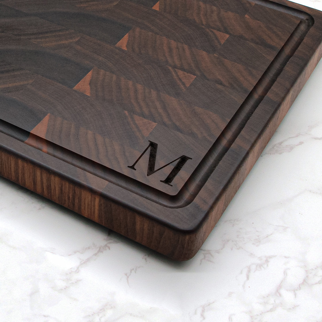 Large monogram end grain cutting board in walnut with engraved M and juice groove on Tampa Home & Garden Store
