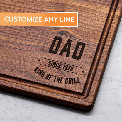 King of the Grill wooden cutting board with brown wood grain and engraved text on Tampa Home & Garden Store