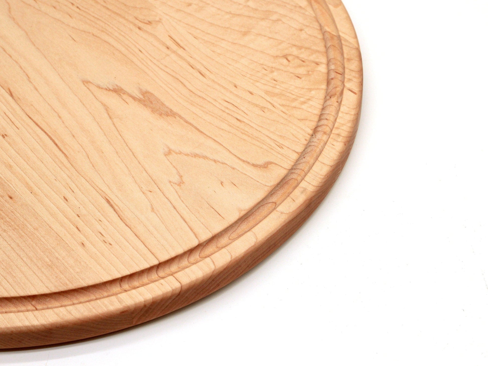 Large round walnut cutting board with visible wood grain and thick edge on Tampa Home & Garden Store
