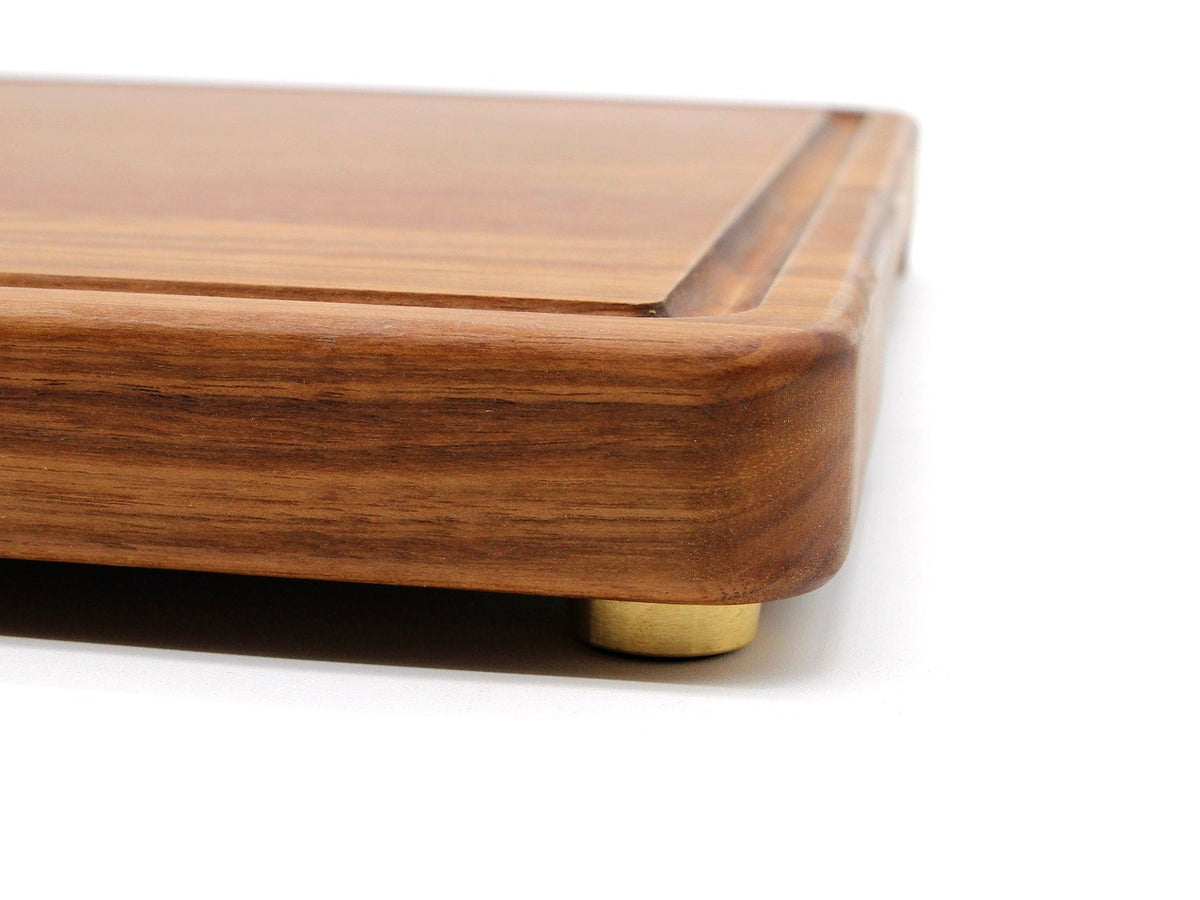 Brass cutting board feet set of 4 with non-slip pads on wooden board corner Refine Kitchenware on Tampa Home & Garden Store