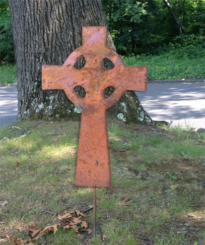Rusty metal garden cross yard stake decor with circular cutouts on Tampa Home & Garden Store