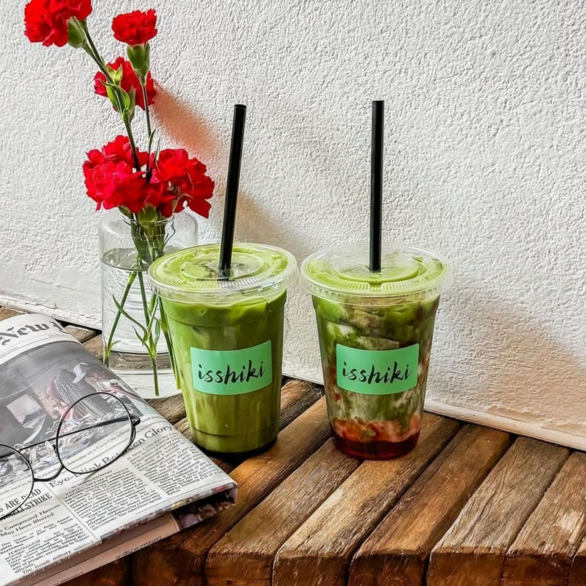Yabukita matcha by isshiki; two iced cups with black straws; green beverages label isshiki on Tampa Home & Garden Store