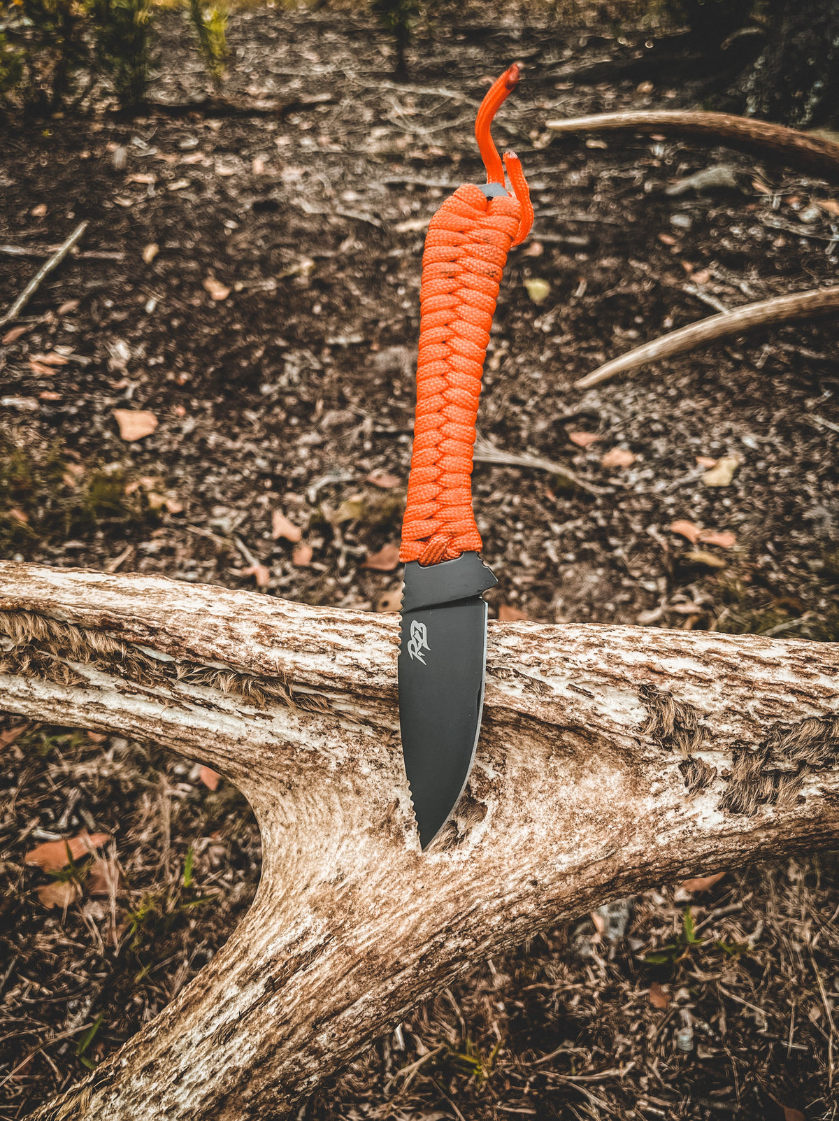Ultralight Ridge Blade knife with orange paracord wrap and matte black blade by Ridge Belts on Tampa Home & Garden Store