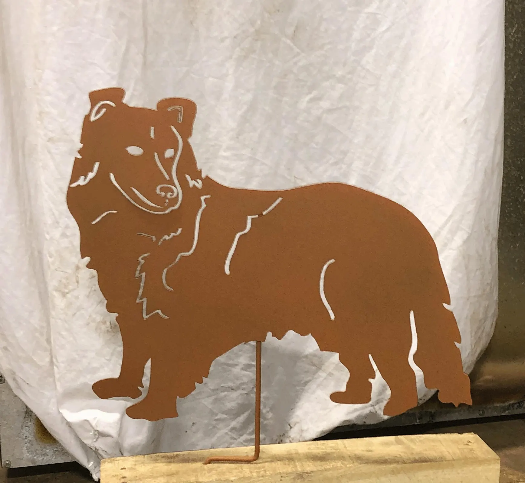 Shetland Sheepdog garden stake silhouette in rust with metal stake by Rustica Ornamentals on Tampa Home & Garden Store