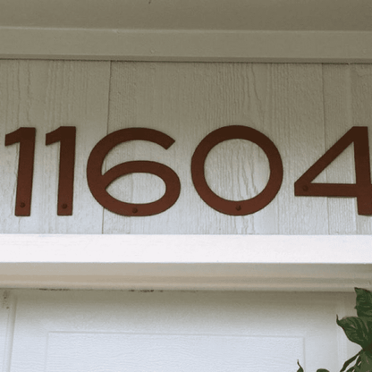Metal Blair house numbers, set of 5 rust-colored digits (2–8 in) with mounting holes on siding on Tampa Home & Garden Store