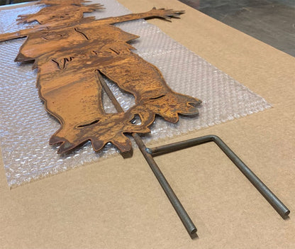 Outdoor scarecrow garden ornament in rusted metal with dual stakes by Rustica Ornamentals on Tampa Home & Garden Store