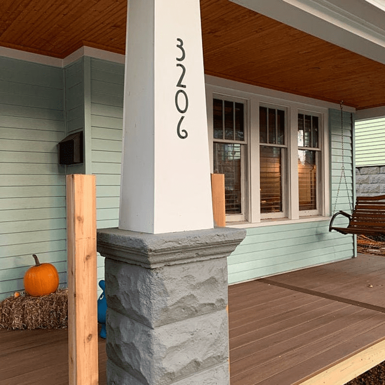 Mission-style house number 3206 on white porch column by Rustica Ornamentals on Tampa Home & Garden Store