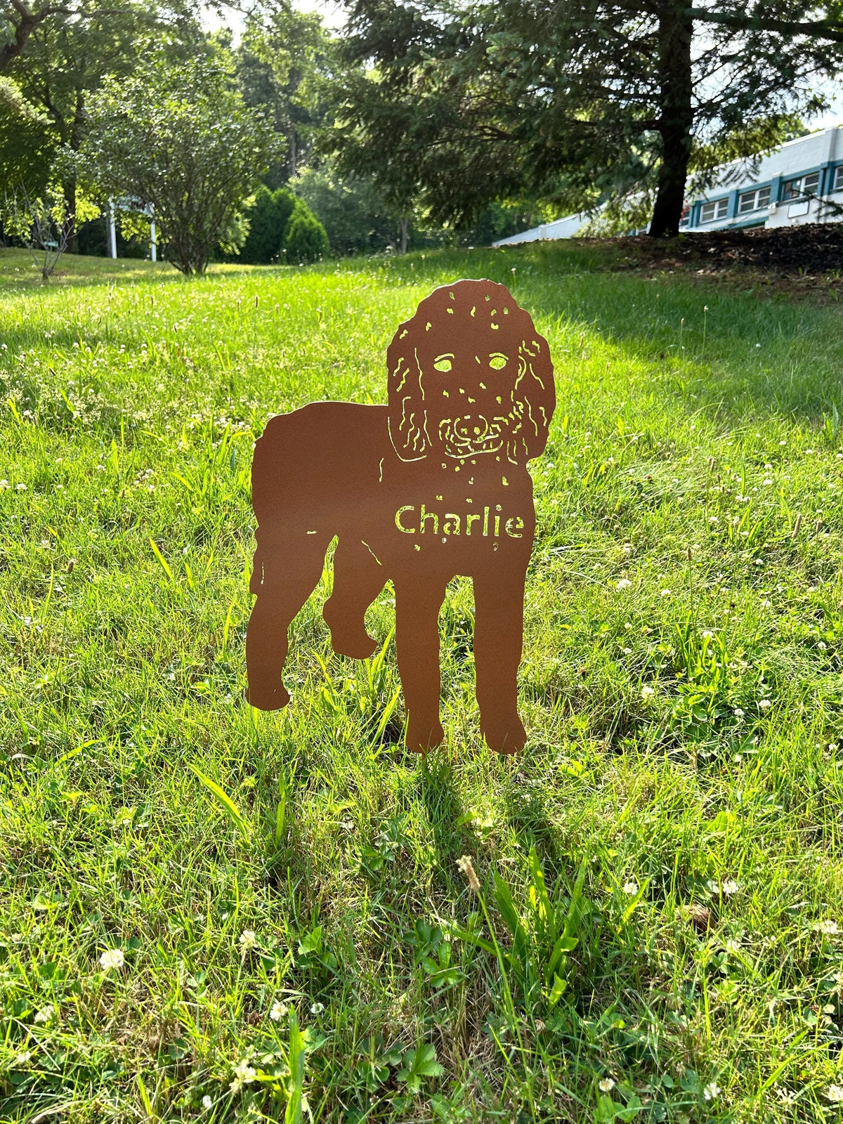 Goldendoodle garden stake metal silhouette in rust color with Charlie name lawn ornament on Tampa Home & Garden Store