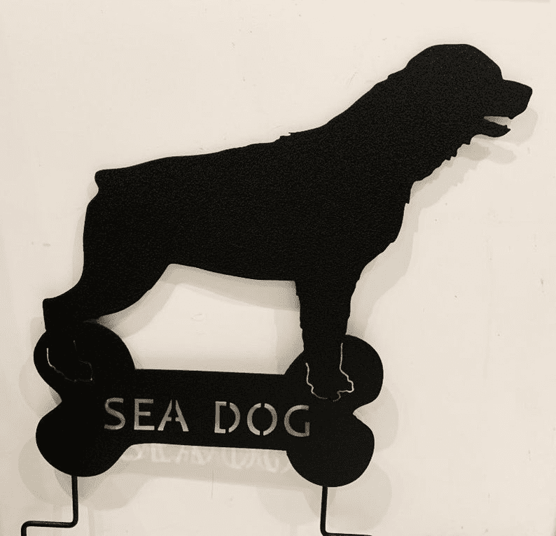 Rottweiler garden stake silhouette in black metal on a bone-shaped base with SEA DOG lettering Rustica Ornamentals on Tampa Home & Garden Store