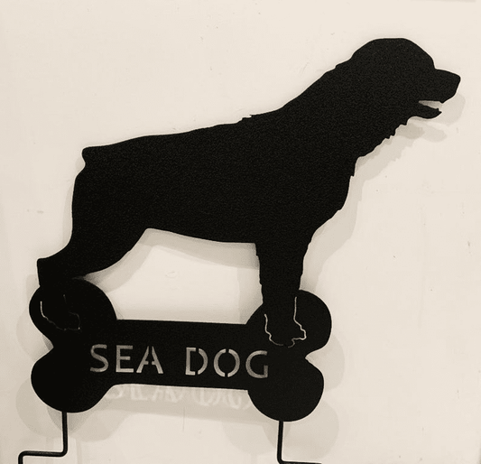 Rottweiler garden stake silhouette in black metal on a bone-shaped base with SEA DOG lettering Rustica Ornamentals on Tampa Home & Garden Store