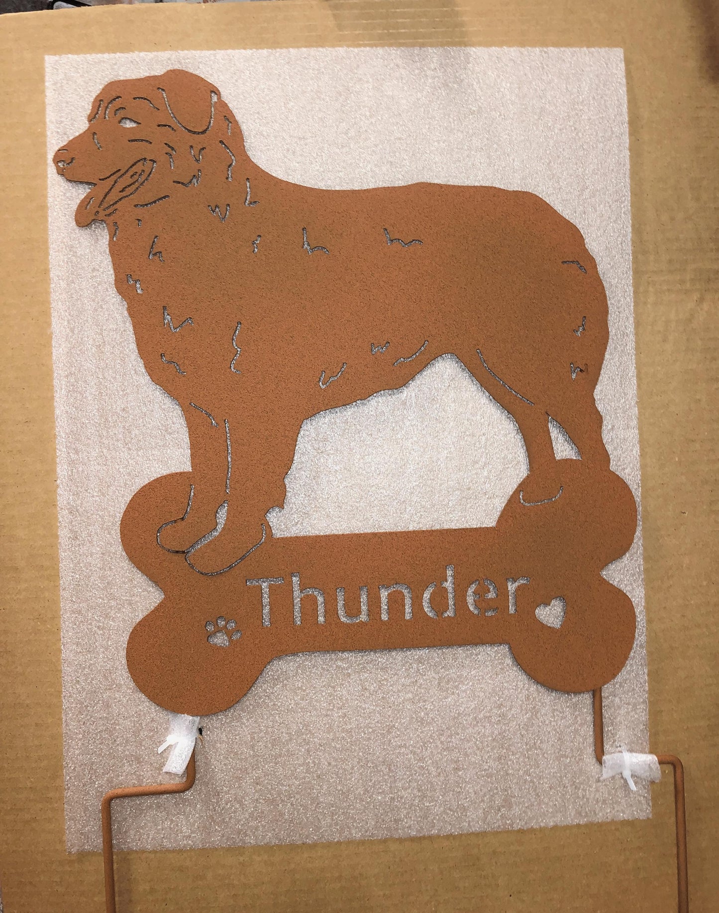 Australian Shepherd statue in rust metal finish wall art for lawn featuring Thunder bone sign on Tampa Home & Garden Store