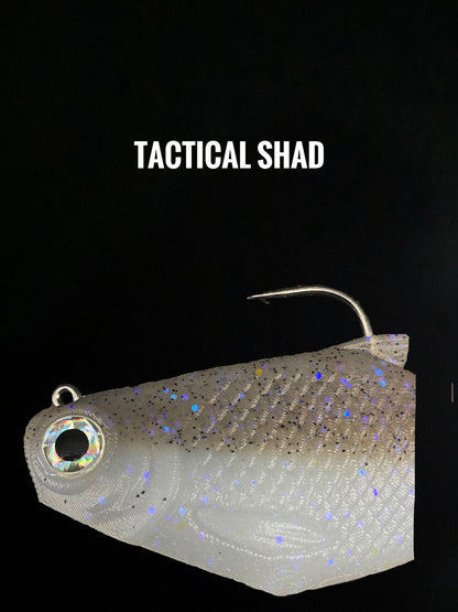 Bacca Burrito boot-tail soft swimbait, grey holographic body with glitter, treble hook visible on Tampa Home & Garden Store