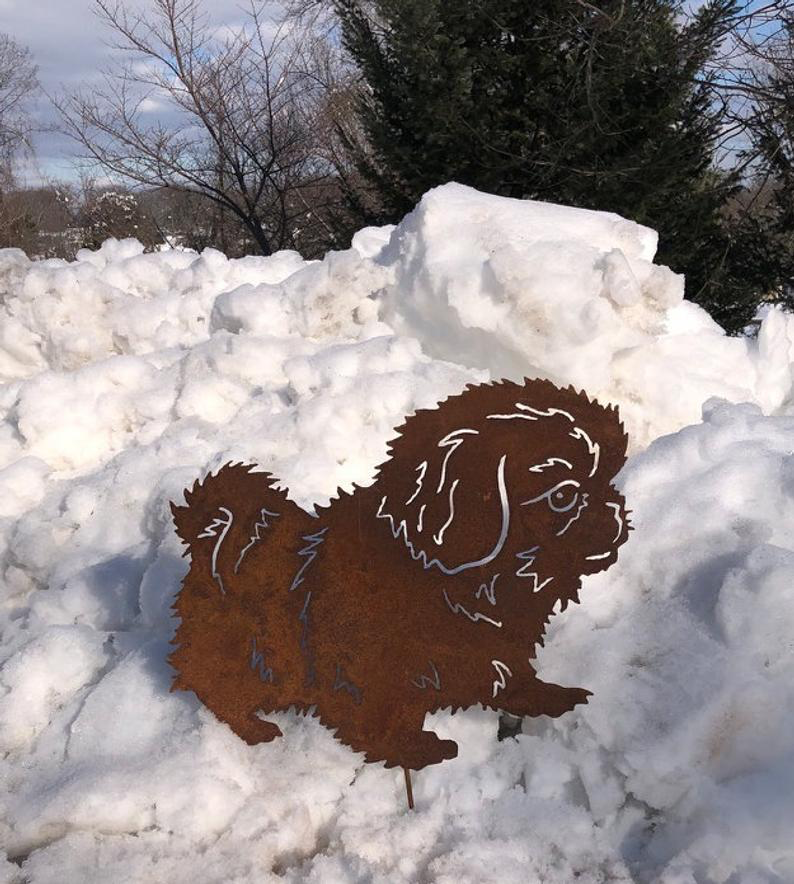 Pekingese garden stake silhouette, rust-colored metal with white fur lines on Tampa Home & Garden Store