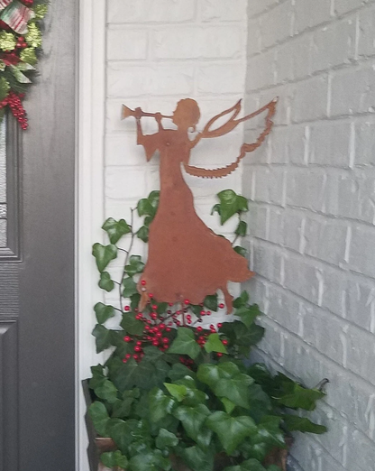 Angel garden stake silhouette in rust metal with trumpet and wings, Christmas decor on Tampa Home & Garden Store