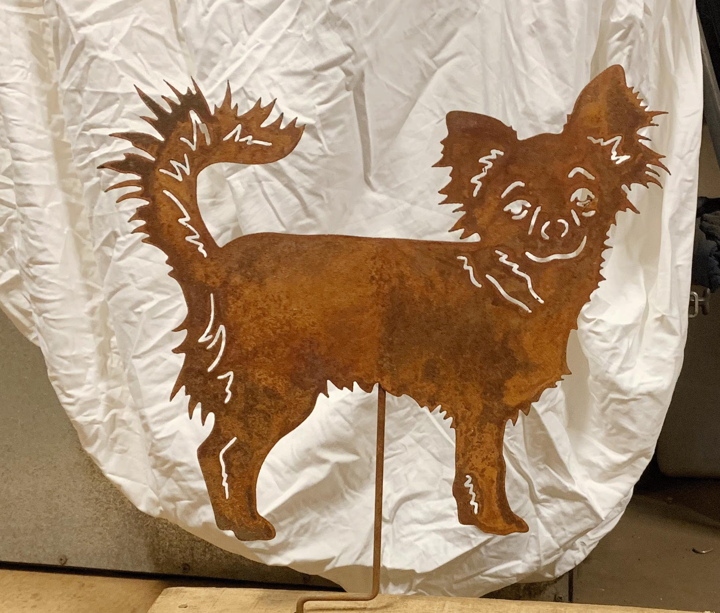 Long-haired Chihuahua garden stake in rust metal by Rustica Ornamentals, lawn ornament on Tampa Home & Garden Store