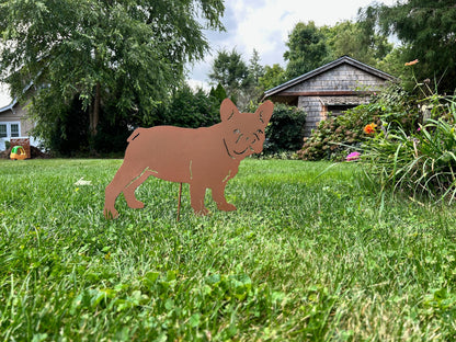 French Bulldog yard statue silhouette, rust-colored metal sculpture in a sunny yard on Tampa Home & Garden Store