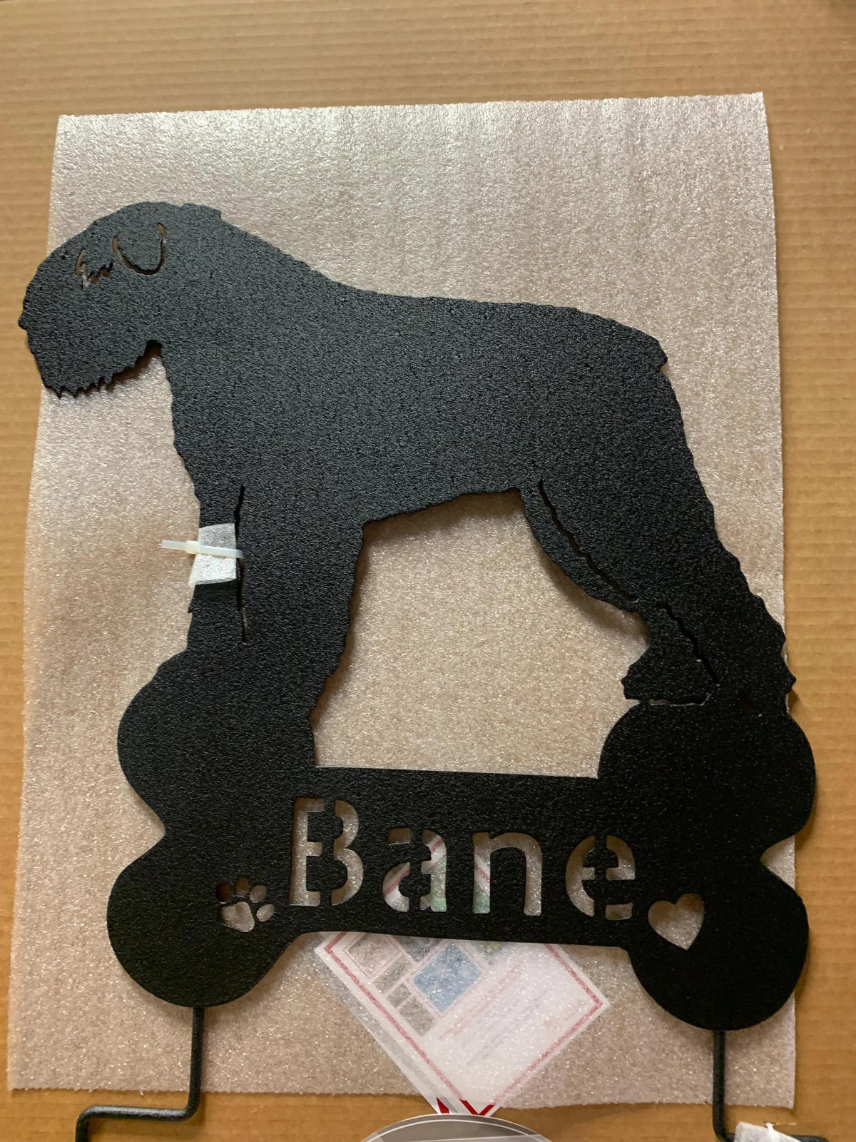 Black metal silhouette of a Bouvier des Flandres garden stake wall art by Rustica Ornamentals on Tampa Home & Garden Store