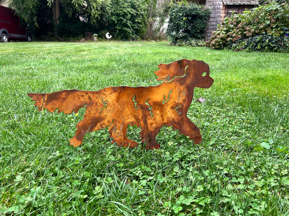 King Charles dog wall art rusted metal silhouette by Rustica Ornamentals outdoor sculpture on lawn on Tampa Home & Garden Store