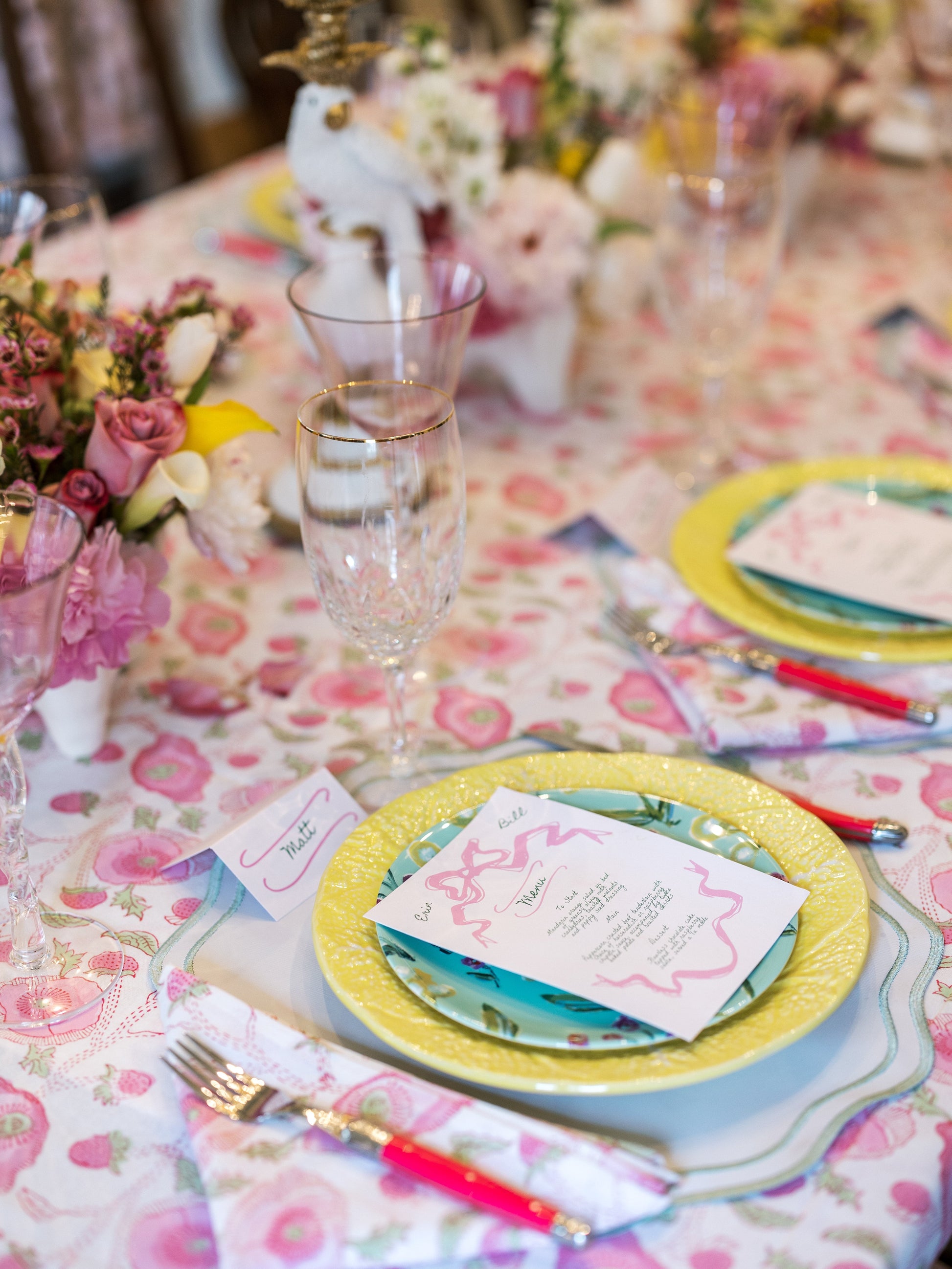 Honeysuckle China plates by Erin Donahue Tice; yellow rim with turquoise center on a table on Tampa Home & Garden Store
