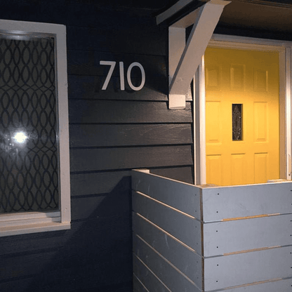 Mission Style House Numbers Set of 5 by Rustica Ornamentals white digits 710 on dark blue siding on Tampa Home & Garden Store