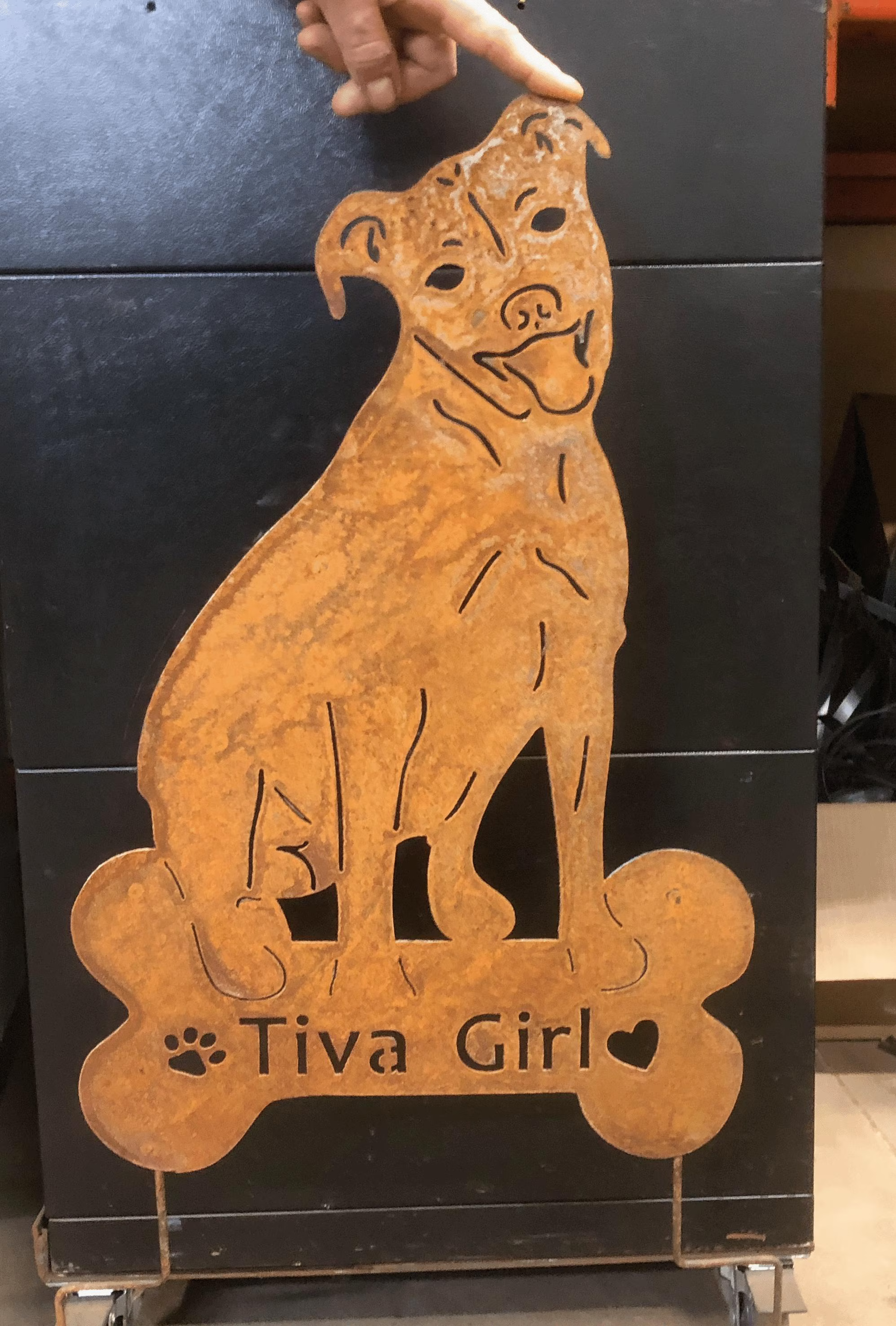 Pit Bull garden statue metal cutout in rust finish with bone-shaped base on Tampa Home & Garden Store