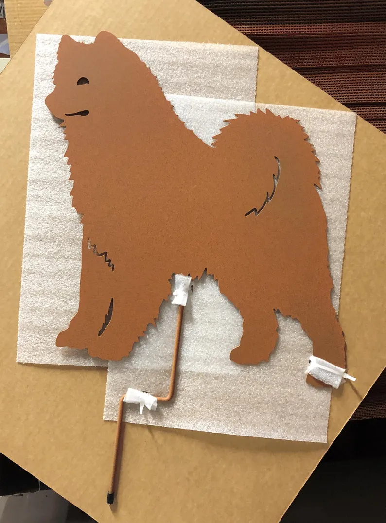 Samoyed garden stake metal silhouette in rust with copper stake by Rustica Ornamentals on Tampa Home & Garden Store