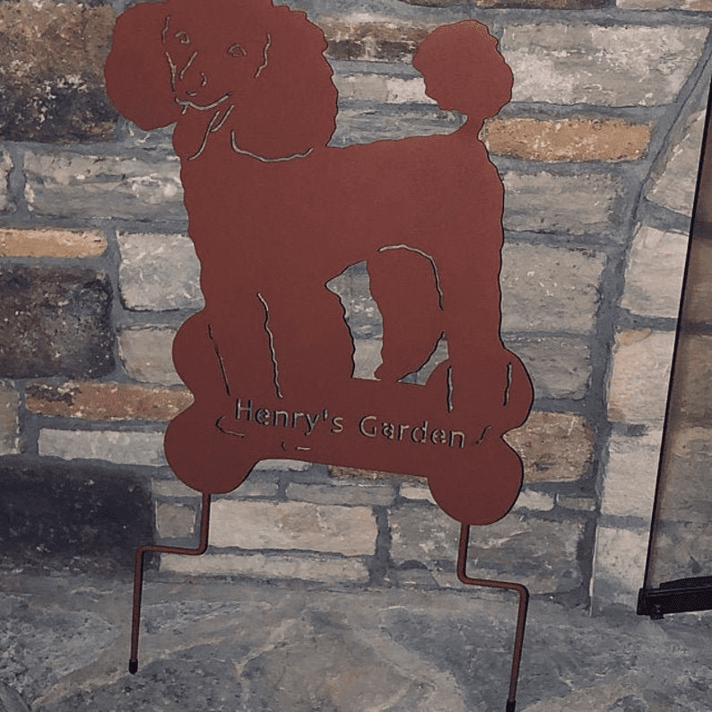 Poodle garden stake by Rustica Ornamentals, rusty silhouette with Henry's Garden text on Tampa Home & Garden Store