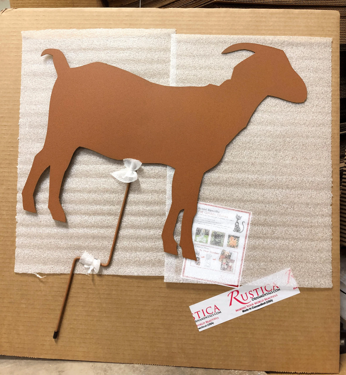 Metal goat yard art silhouette in rust color on stake, Rustica Ornamentals lawn decor on Tampa Home & Garden Store