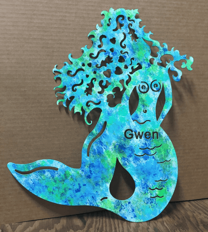 Mermaid wall art metal silhouette with turquoise-green patina and Gwen on torso on Tampa Home & Garden Store