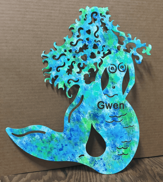 Mermaid wall art metal silhouette with turquoise-green patina and Gwen on torso on Tampa Home & Garden Store
