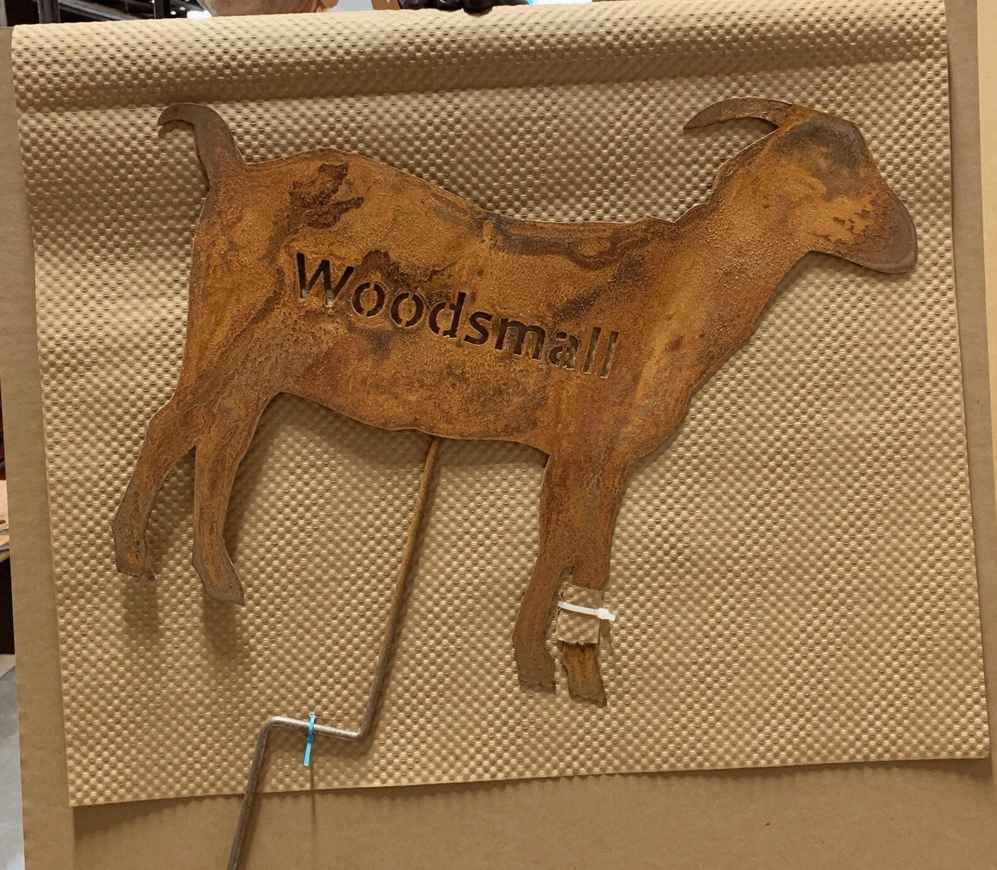 Metal goat yard art silhouette with rusted finish and Woodsmill cutout lettering, wall decor on Tampa Home & Garden Store