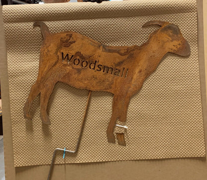 Metal goat yard art silhouette with rusted finish and Woodsmill cutout lettering, wall decor on Tampa Home & Garden Store