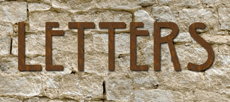 Mission Style House Letters set of 6 by Rustica in rusted metal mounted on a stone wall on Tampa Home & Garden Store